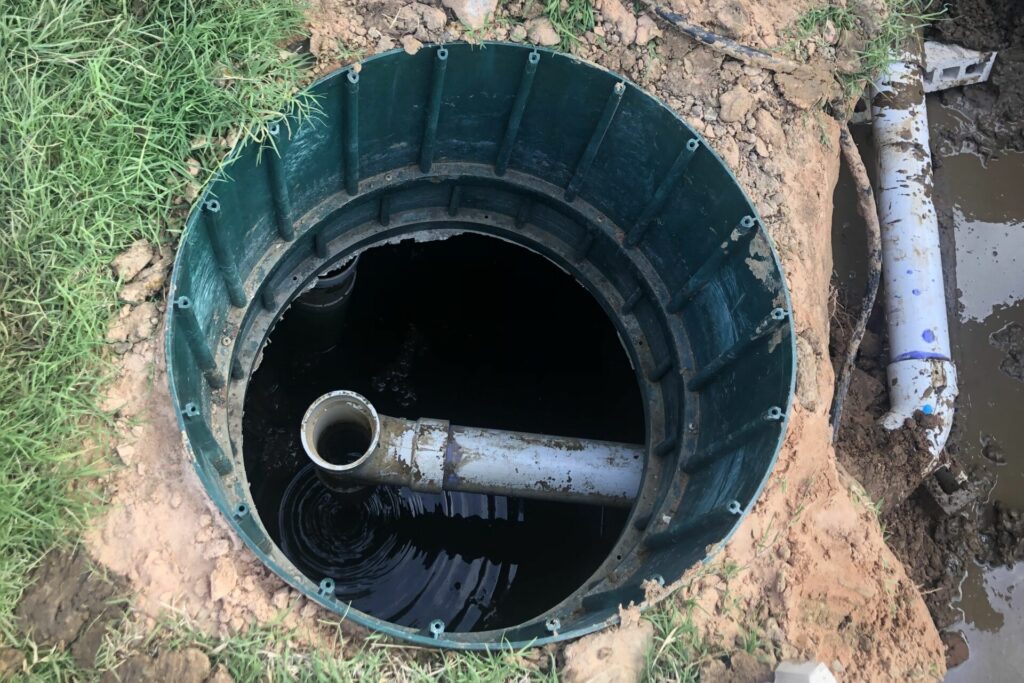 looking into the open trash tank of an aerobic septic system