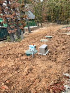 control panel for an aerobic septic system installed for a new home with a plastic aerator cover in Arcadia Oklahoma