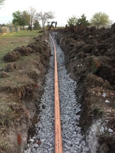 20160408_003454969_iOS | Cyclone Septic & Plumbing septic lateral line being installed by Cyclone Septics in Guthrie Oklahoma