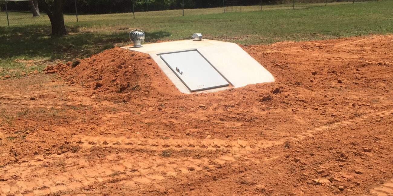 20170718_180831292_iOS | Cyclone Septic & Plumbing a slope front precast concrete storm shelter installed by Cyclone Septics