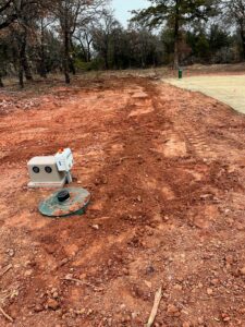 A NuWater aerobic septic system installed for a new home in Arcadia Oklahoma by Cyclone Septics with the control panel mounted on the tank