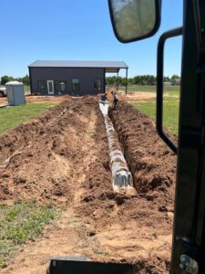f826f657f45fe2f920231105-88-k0nwt | Cyclone Septic & Plumbing a conventional septic system with geotextile fabric over chambers in sandy soil installed by Cyclone Septics in Crescent Oklahoma