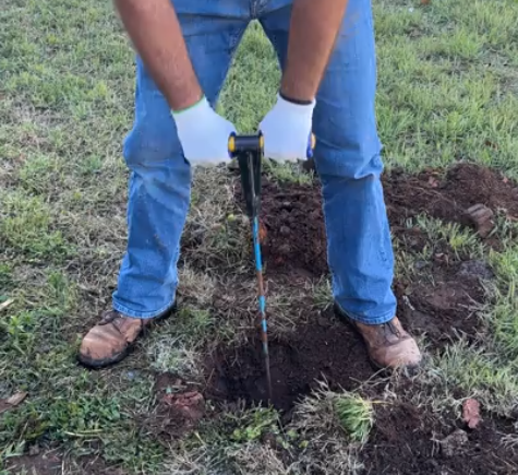 using a probe to find a septic tank in Guthrie