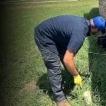 Cyclone Septics technician inspecting a septic and plumbing line at an Oklahoma home with professional camera equipment.