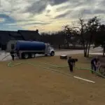 Cyclone Septic & Plumbing pump truck servicing a residential septic system in Arcadia, Oklahoma