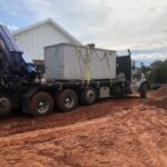 Septic System delivery in Newalla, Oklahoma | Cyclone Septic & Plumbing Aerobic septic system being delivered to a home in Newalla, Oklahoma