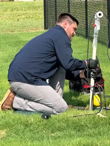 Cyclone technician servicing an aerobic septic system in Guthrie, Oklahoma