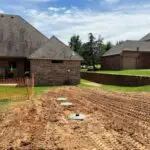 Aerobic Septic System Installation in Oklahoma City, OK | Cyclone Septic & Plumbing Newly installed aerobic septic system with access risers at an Oklahoma City home