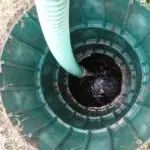 Septic Tank Pumping in Oklahoma City, OK | Cyclone Septic & Plumbing Septic tank being pumped through an access riser in Oklahoma City, Oklahoma