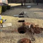 Septic System Inspection in Edmond, OK | Cyclone Septic & Plumbing Open septic tank access points during a septic inspection in Edmond, Oklahoma