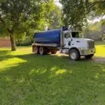 Edmond Septic Tank Pumping Service | Cyclone Septic & Plumbing Cyclone septic pumping truck at a residential property in Edmond, Oklahoma