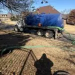 Residential Septic Pumping in Edmond, OK | Cyclone Septic & Plumbing yclone vacuum truck pumping a residential septic tank in Edmond, OK