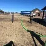 Septic Tank Pumping in Guthrie, OK | Cyclone Septic & Plumbing Cyclone vacuum truck pumping a residential septic tank in Guthrie, Oklahoma
