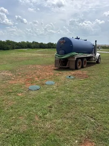 Cyclone Septic & Plumbing pumping truck servicing a property in Piedmont, Oklahoma