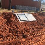 In-Ground Storm Shelter Installation in Blanchard, OK | Cyclone Septic & Plumbing In-ground storm shelter installed on a rural property in Blanchard, Oklahoma