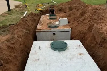 Cyclone Septic & Plumbing crew installing a commercial septic tank system in Crescent, Oklahoma
