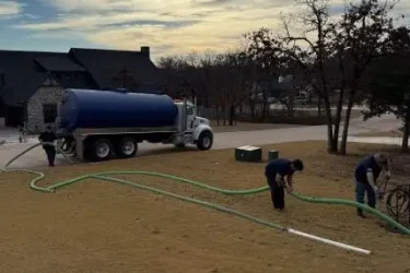 Cyclone Septic & Plumbing pump truck servicing a residential septic system in Arcadia, Oklahoma