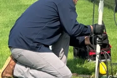 Cyclone technician servicing an aerobic septic system in Guthrie, Oklahoma