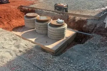 Commercial septic system installation with multiple access risers in Guthrie, Oklahoma
