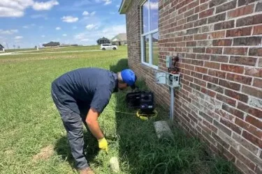 Cyclone Septic & Plumbing technician performing an inspection on a septic system in Piedmont OK