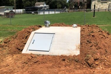 In-ground storm shelter installed on a rural property in Choctaw, Oklahoma