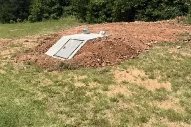 In-ground storm shelter installed by Cyclone Septic & Plumbing in Guthrie, Oklahoma