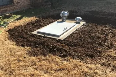 In-ground storm shelter installed in the yard of an Oklahoma City home